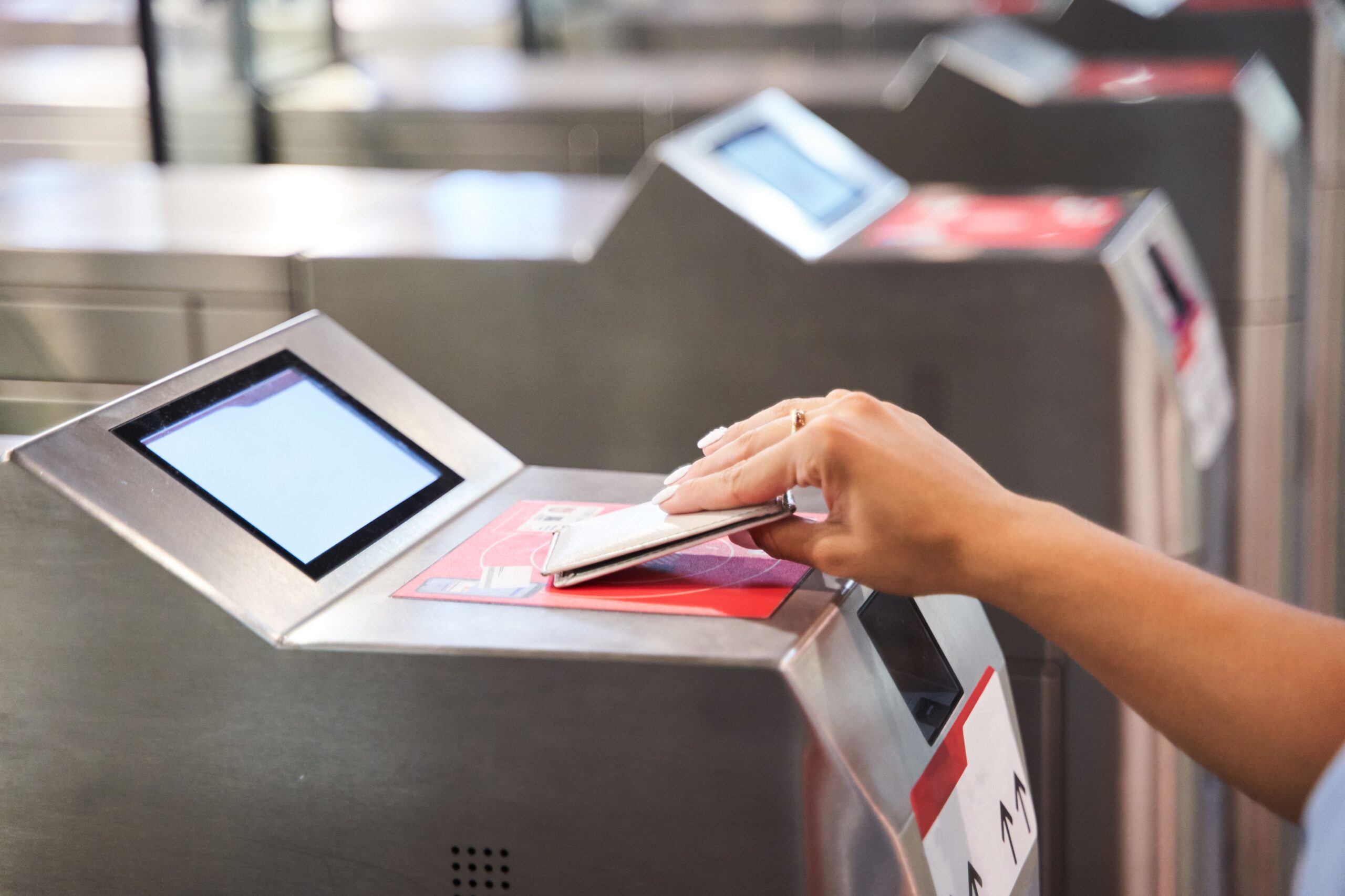 A female doing online payment with card in airport